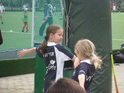 Lottie warming up with her hockey team.