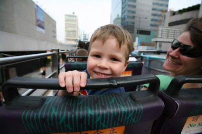 Tirip on open top bus on way to Peak tram station.