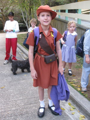 Lottie in her Brownie uniform waiting for the shcool bus.