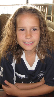 Off to Hockey with frizzy hair.