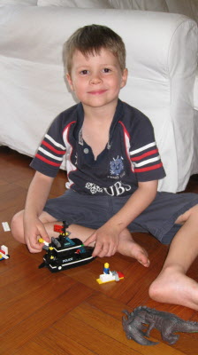 Conrad playing with his lego.
