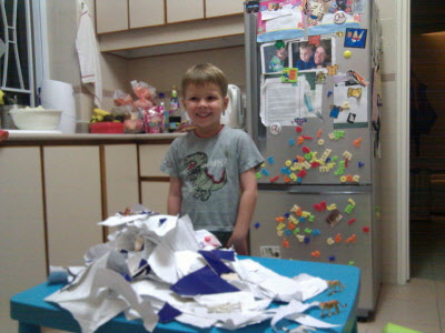 Conrad with an old magazine making a volcano.