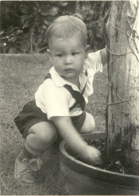 1962 - Peter interfering with Mums orchids!