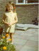 Susan with pig-tails on the patio.